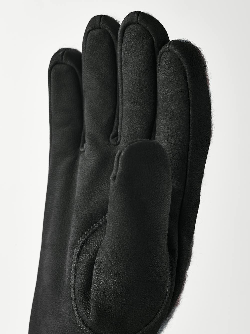 Dark blue machine-sewn goat nubuck glove with multicolored wool jersey back
(3 of 4)