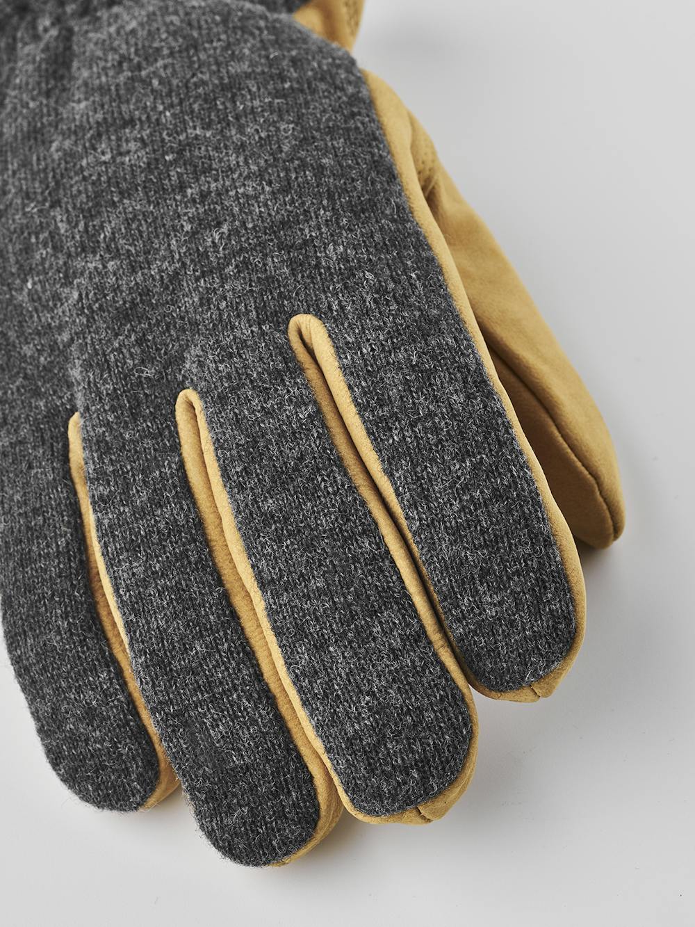 Yellowish-beige machine-sewn goat nubuck glove with dark gray wool jersey back
(3 of 8)