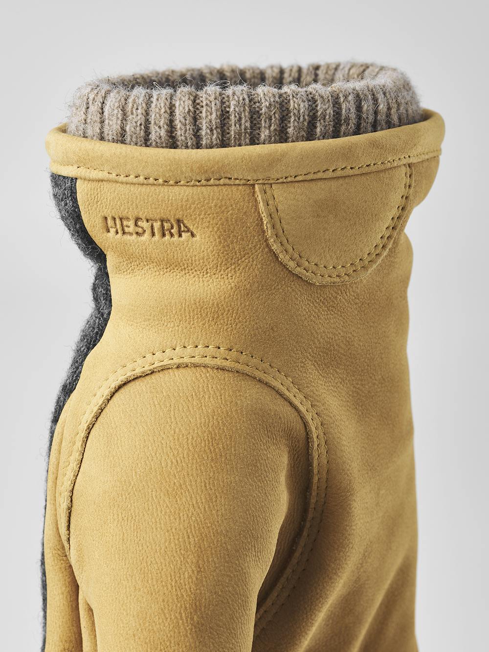 Yellowish-beige machine-sewn goat nubuck glove with dark gray wool jersey back
 (5 of 8)
