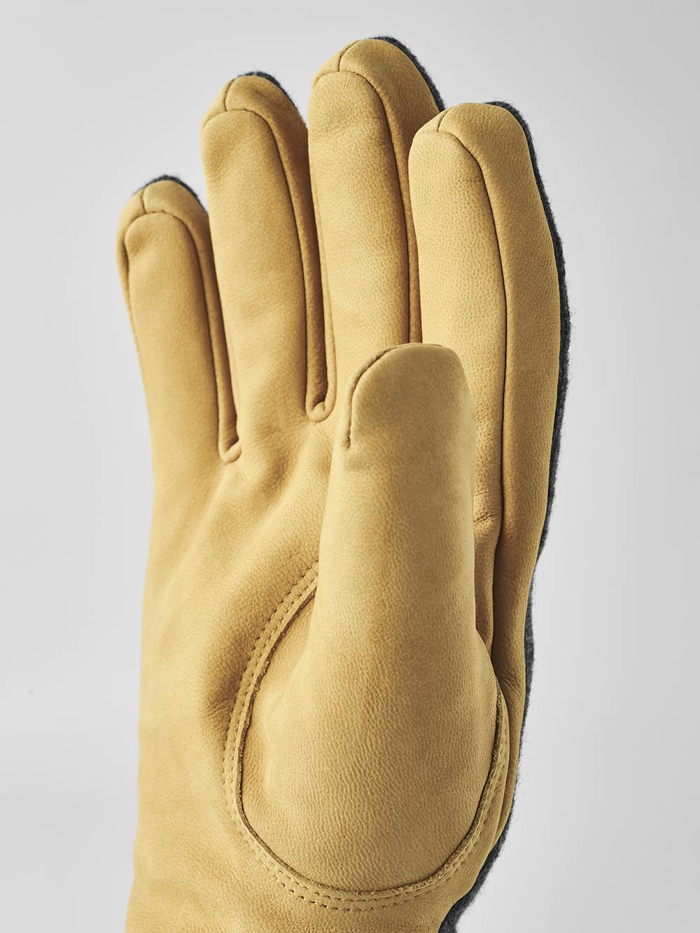 Yellowish-beige machine-sewn goat nubuck glove with dark gray wool jersey back
(7 of 8)