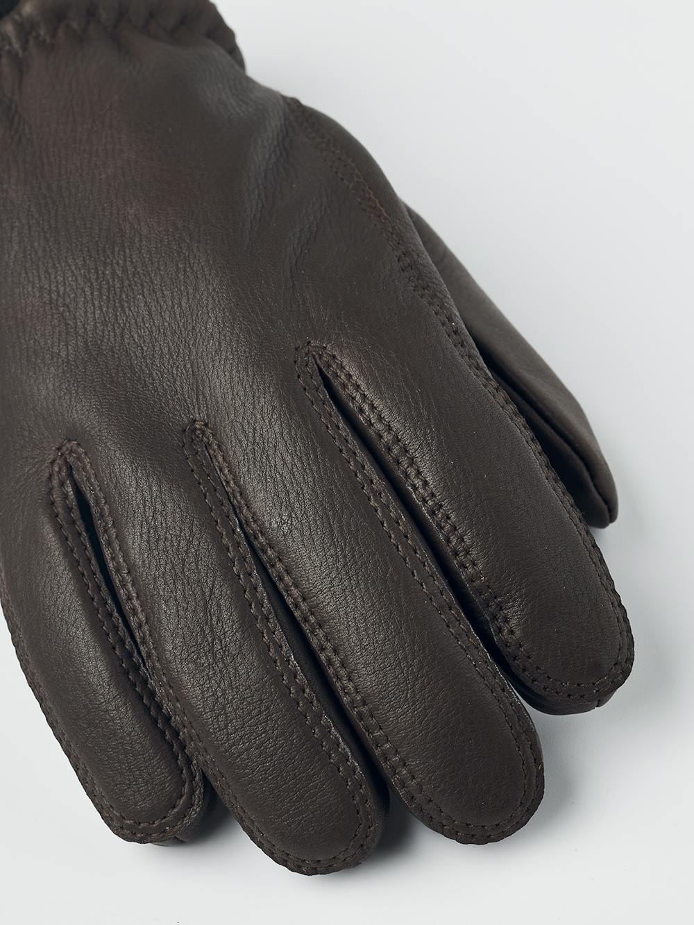 Brown machine-sewn deerskin glove with knitted cuff

 (3 of 4)