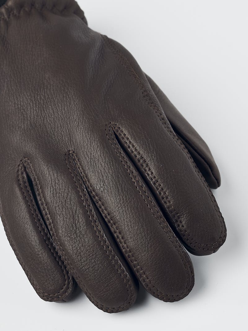 Brown machine-sewn deerskin glove with knitted cuff

 (3 of 4)