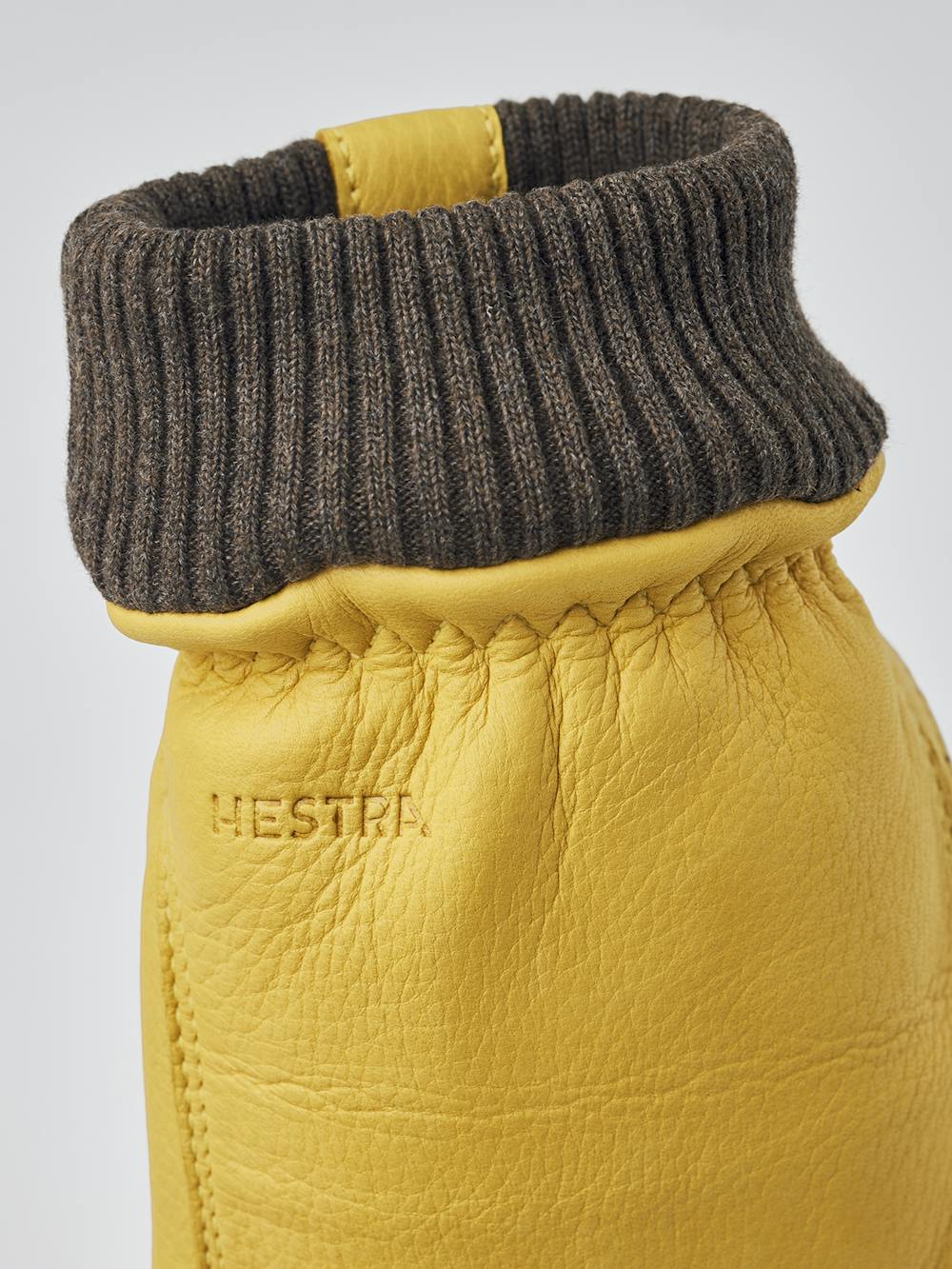 Yellow machine-sewn deerskin glove with knitted cuff
 (3 of 8)