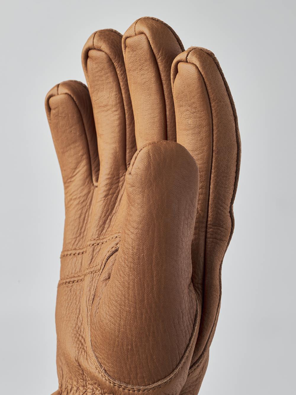 Light brown machine-sewn deerskin glove with knitted cuff
(7 of 8)
