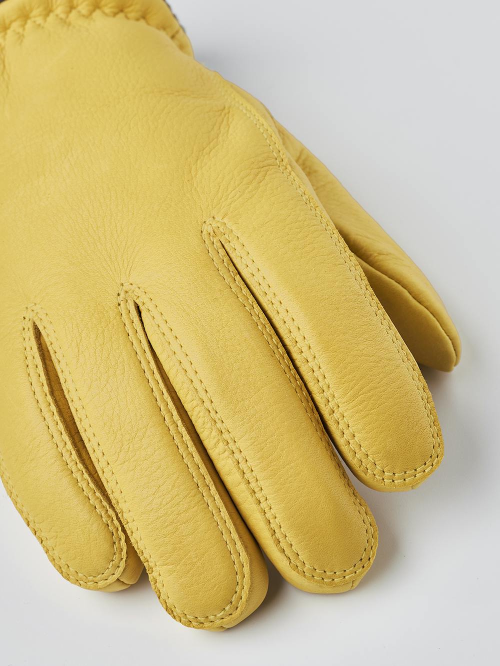 Yellow machine-sewn deerskin glove with knitted cuff
 (5 of 8)