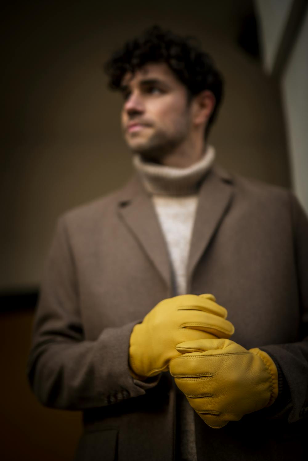 Yellow machine-sewn deerskin glove with knitted cuff
(8 of 8)