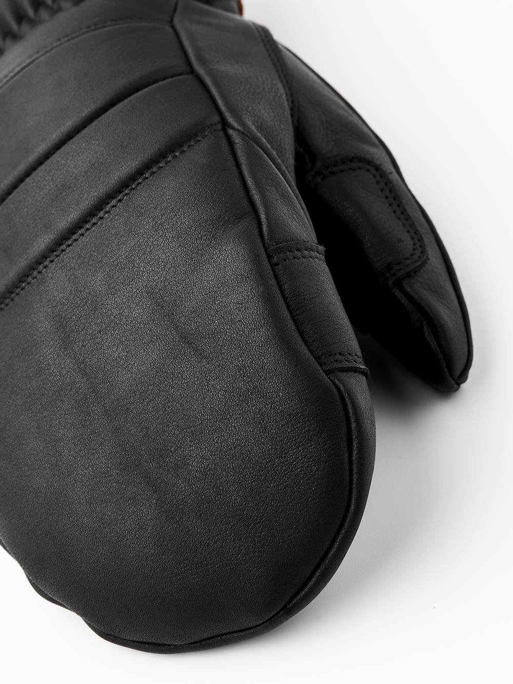 Svart tumhandske i nötnappa
(5 av 8)