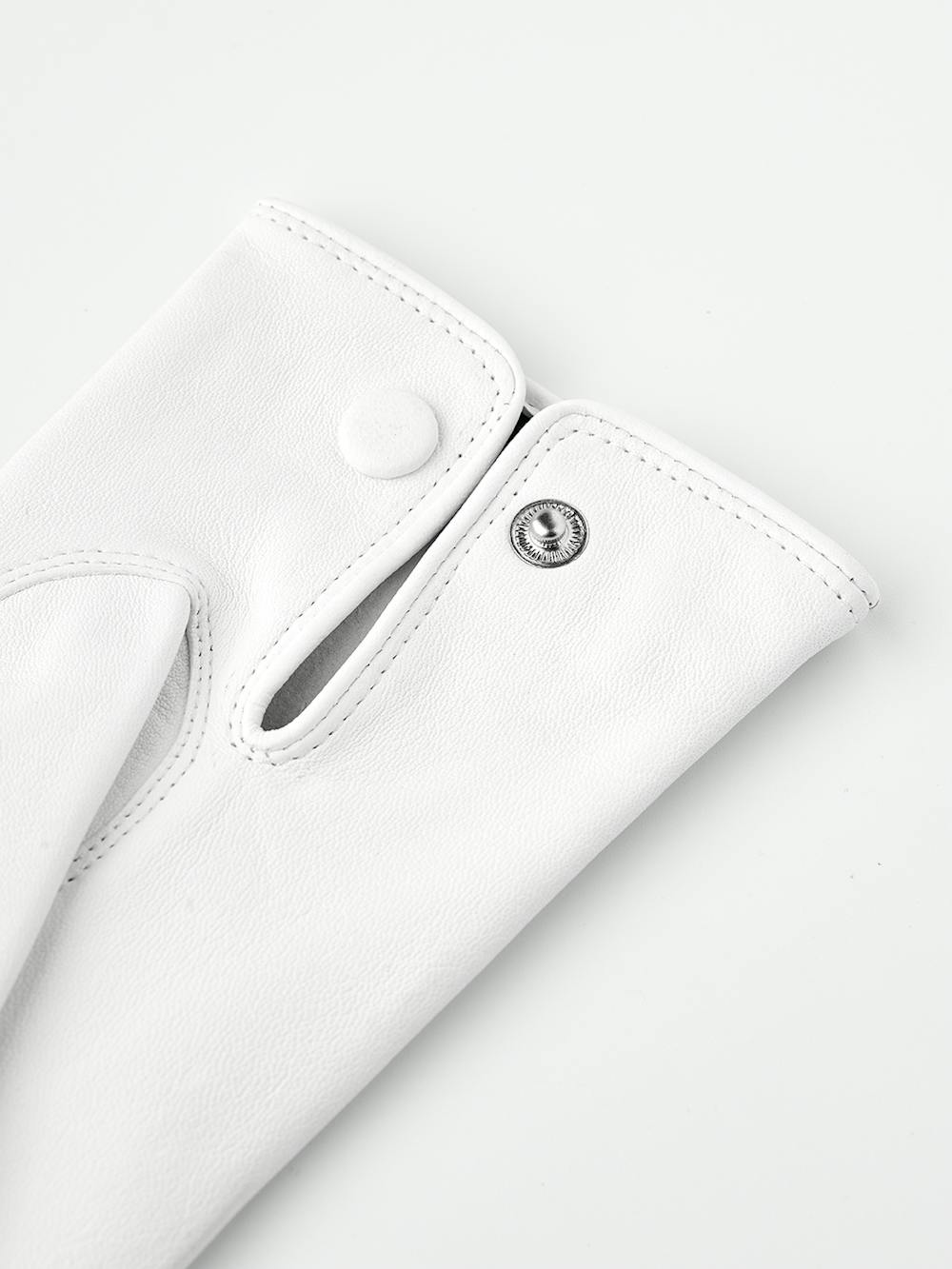 White machine-sewn leather glove with button
 (5 of 5)
