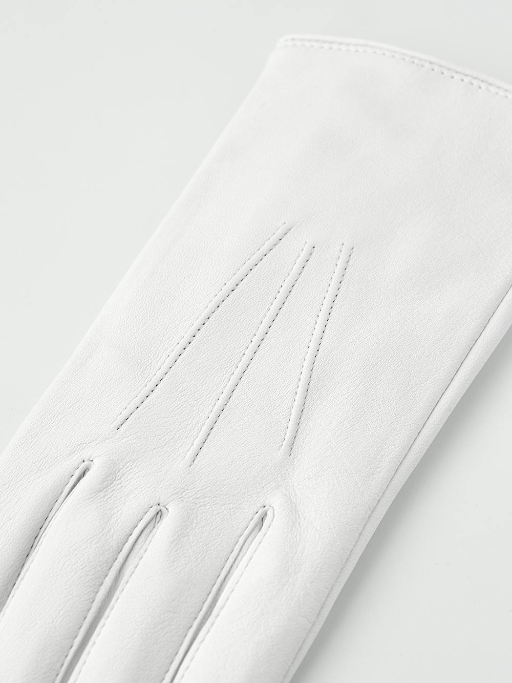 White machine-sewn leather glove with button
 (4 of 5)