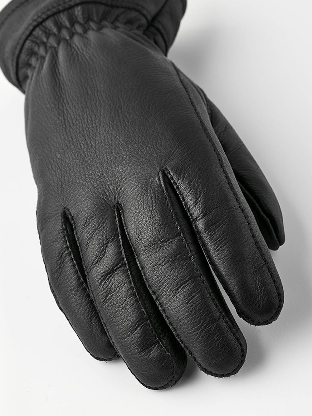 Black machine-sewn deerskin glove with white trim
(4 of 4)