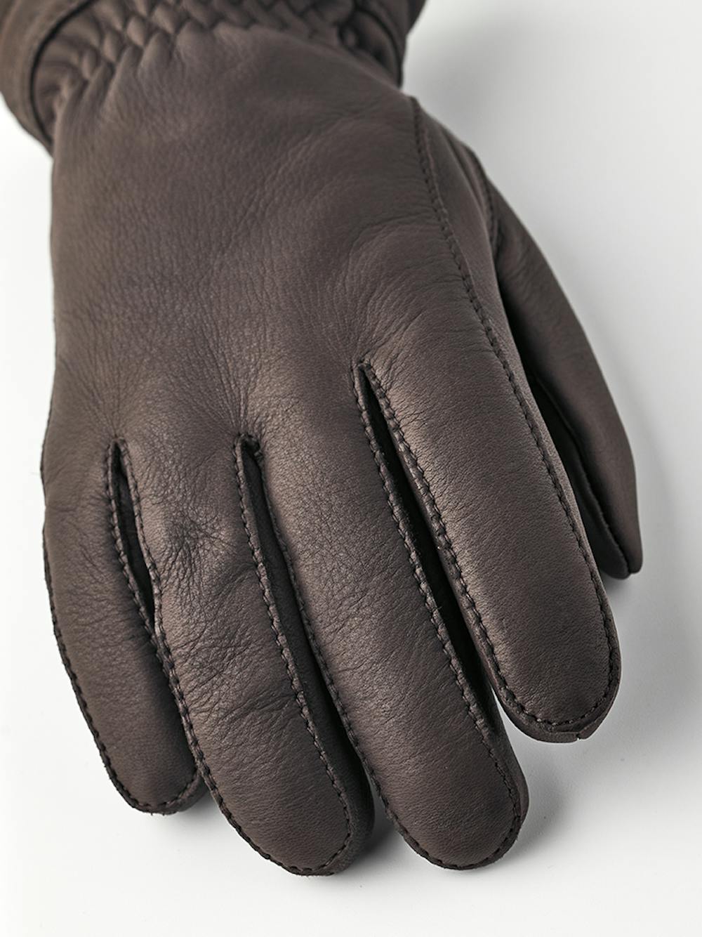 Dark brown machine-sewn deerskin glove with white trim
(4 of 4)