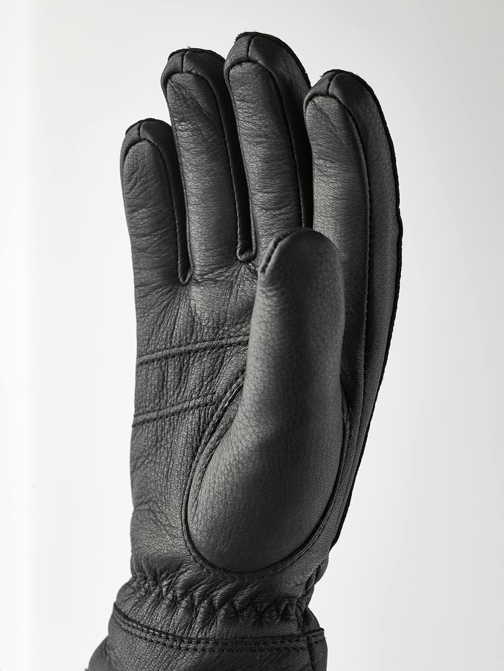 Black machine-sewn deerskin glove with white trim
(2 of 4)