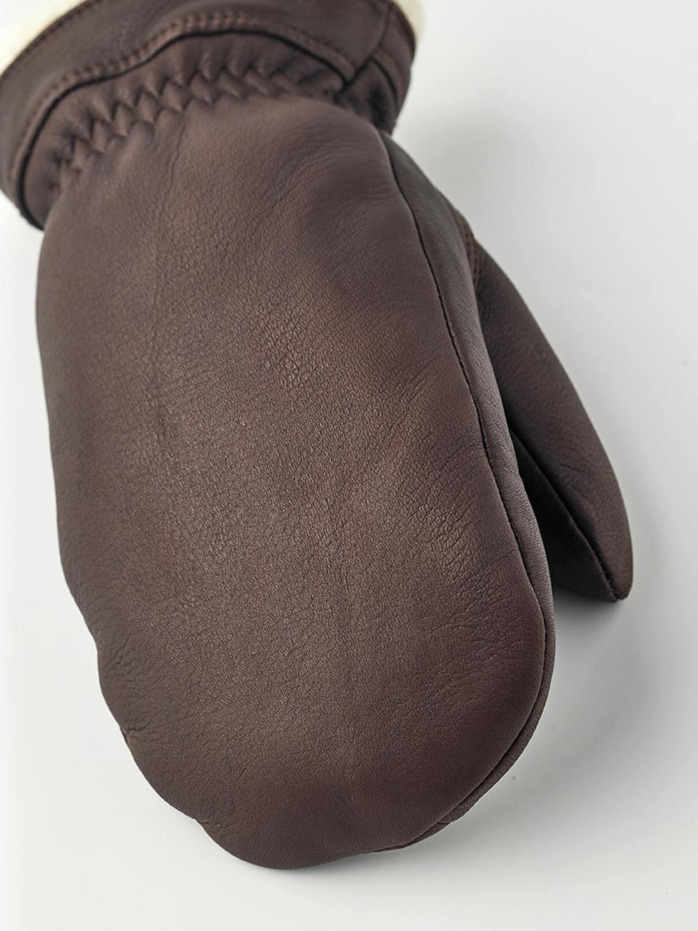 Brown deerskin mitten with white trim
 (3 of 4)