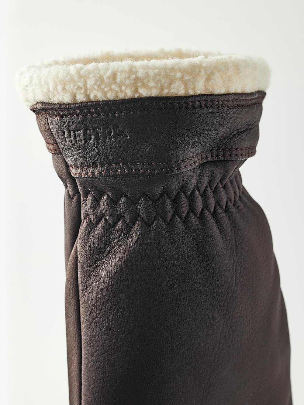 Brown deerskin mitten with white trim
(2 of 4)
