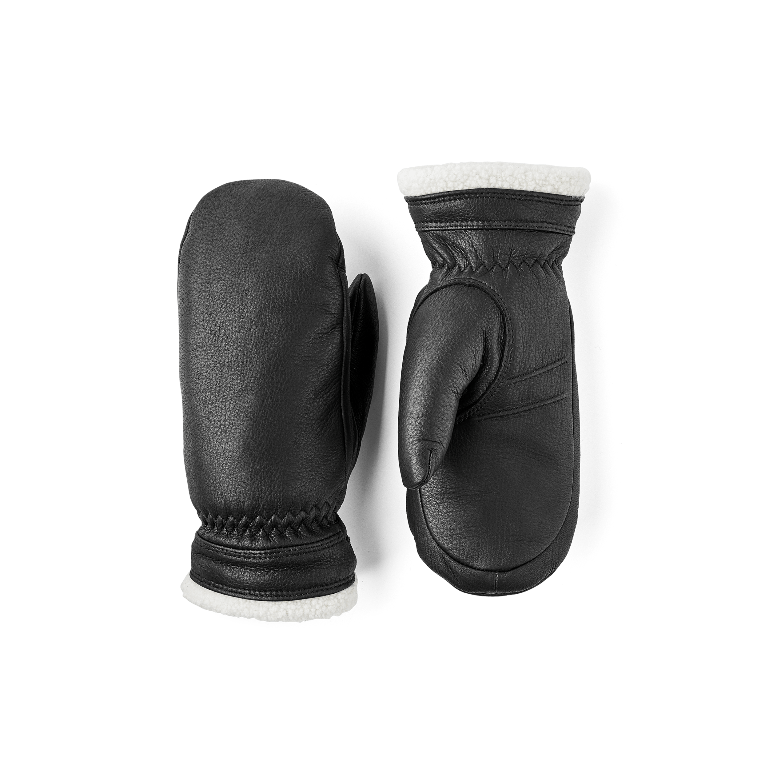 Svart tumhandske i hjortskinn med vit krage
 (1 av 4)