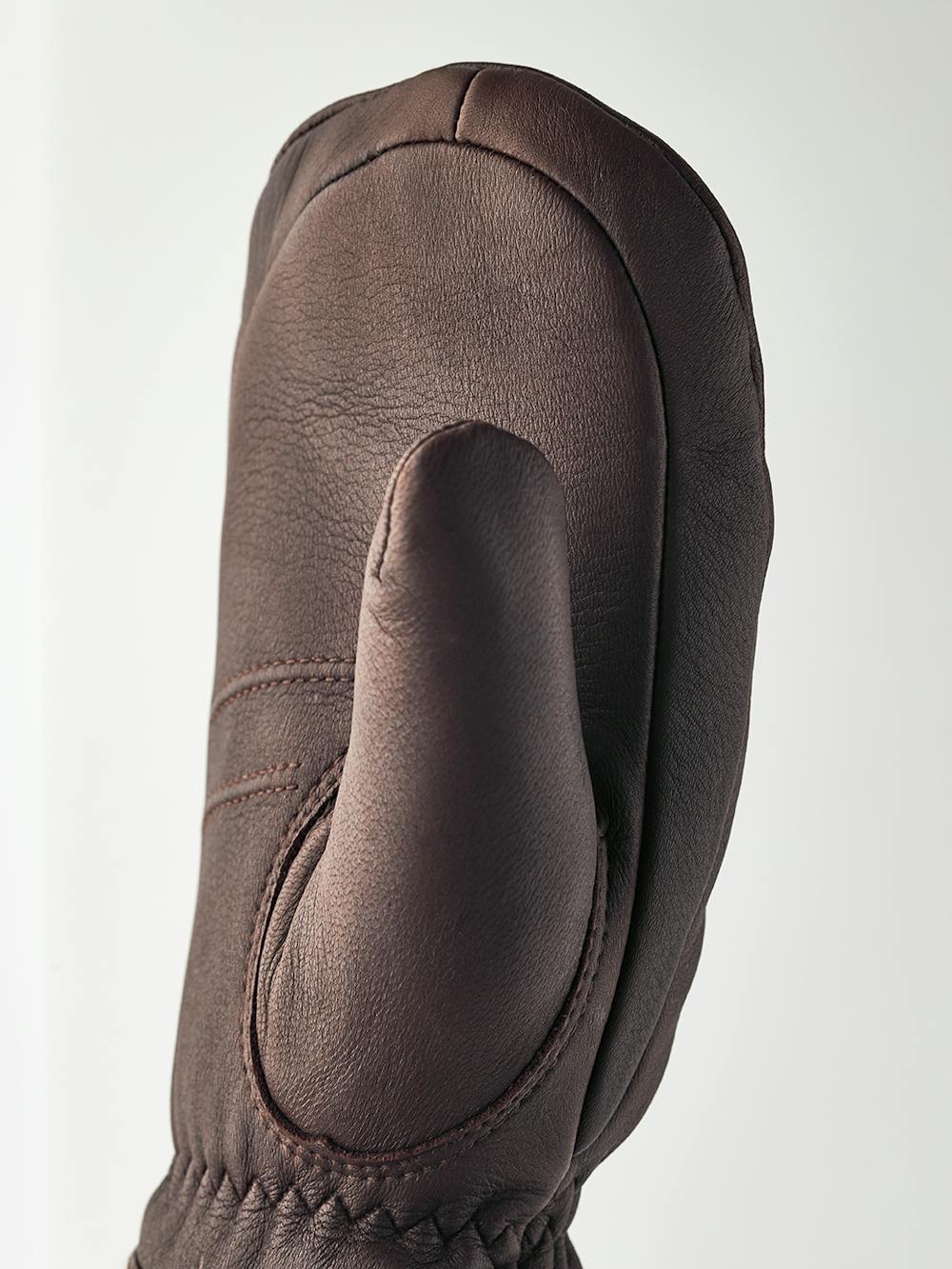 Brown deerskin mitten with white trim
(4 of 4)