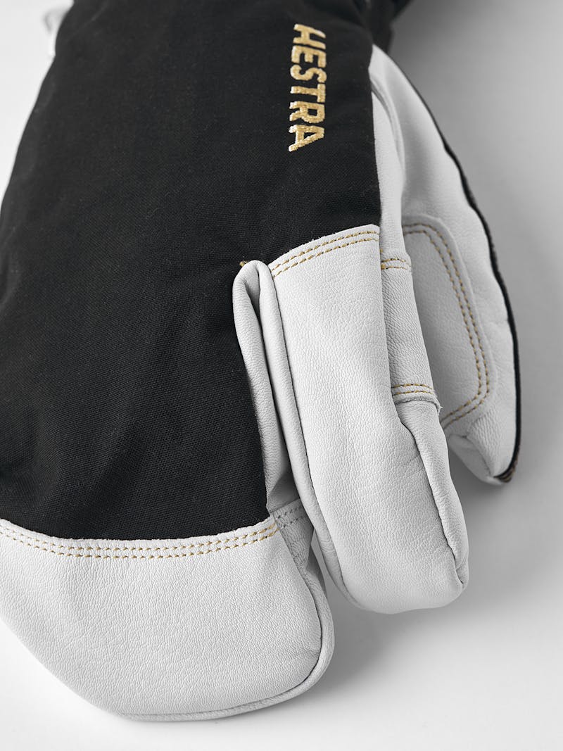 Black three finger glove with white goat leather palm and wrist adjustment 
 (2 of 6)