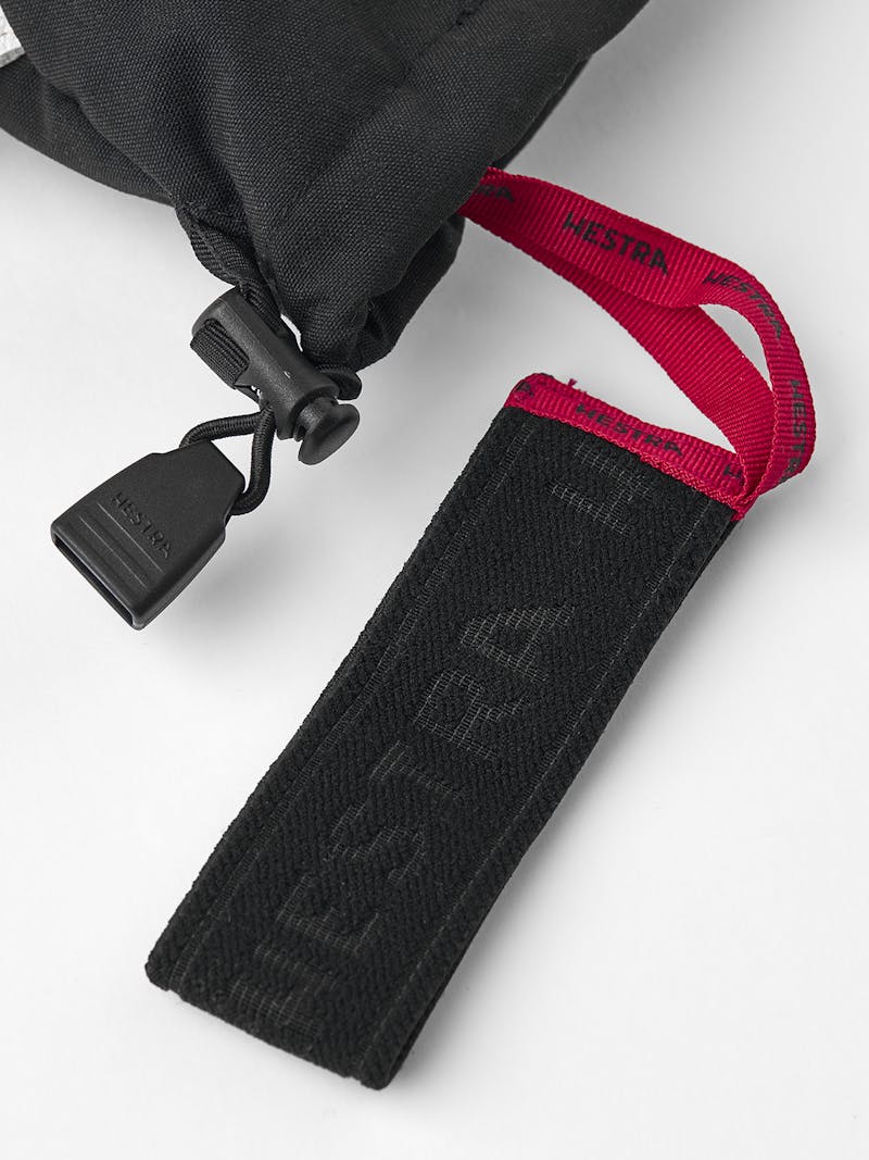 Black three finger glove with white goat leather palm and wrist adjustment 
 (6 of 6)