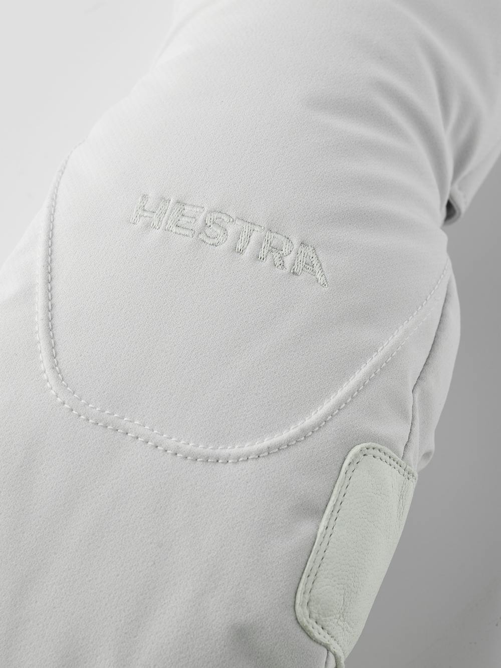 Weißer Fausthandschuh aus Stoff mit weißem Haarschafleder an der Innenhand (3 oder 5)