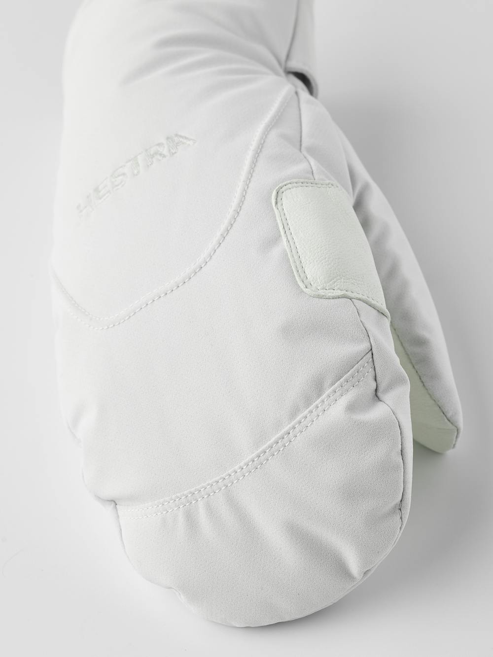 Weißer Fausthandschuh aus Stoff mit weißem Haarschafleder an der Innenhand (4 oder 5)