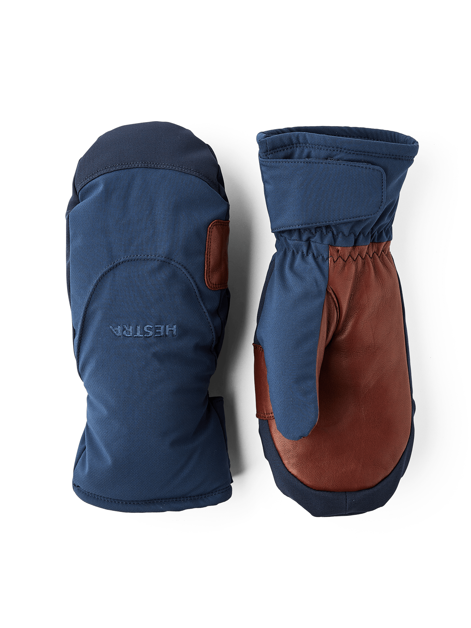 Mörkblå tumhandske i tyg med mörkbrun lammnappa i innerhanden
 (1 av 5)