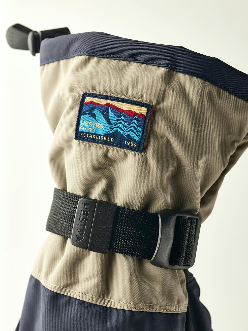 Blue and beige fabric ski glove with black synthetic palm (5 of 5)