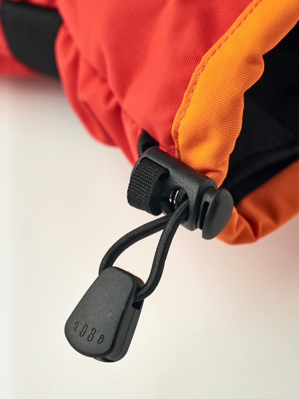 Orange and red fabric ski glove with black synthetic palm (5 of 5)