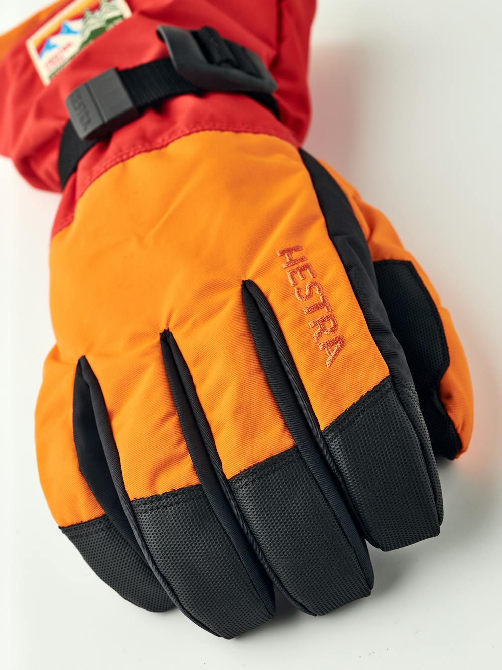 Orange and red fabric ski glove with black synthetic palm (3 of 5)