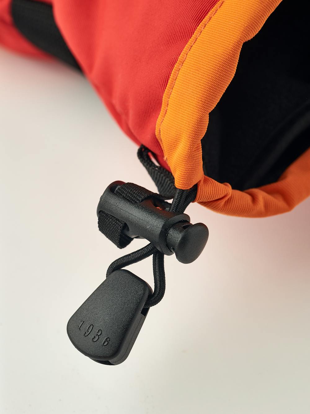 Orange and red fabric mitten with black synthetic palm (5 of 5)