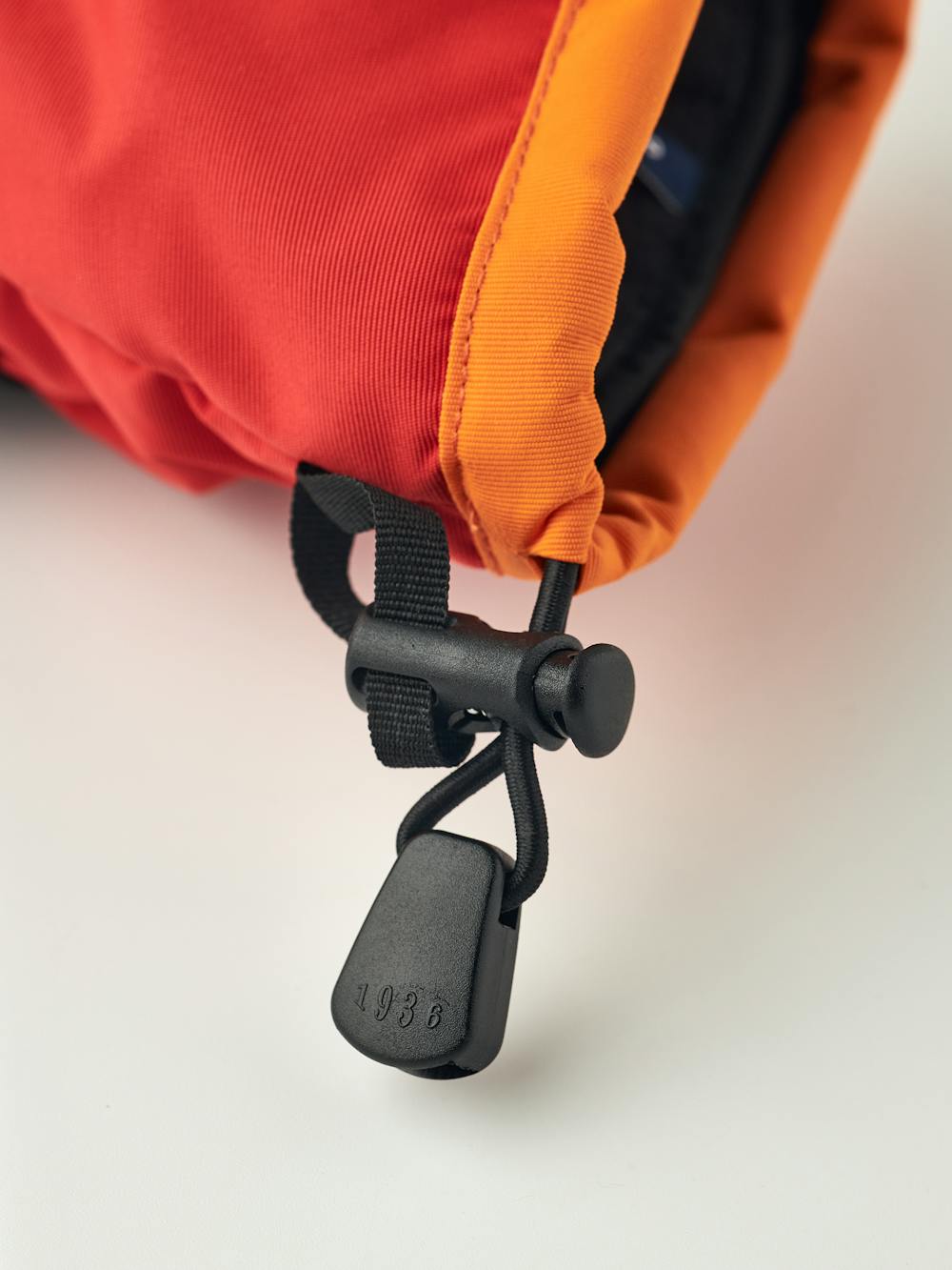 Orange and red fabric three finger glove with black synthetic palm  (5 of 5)