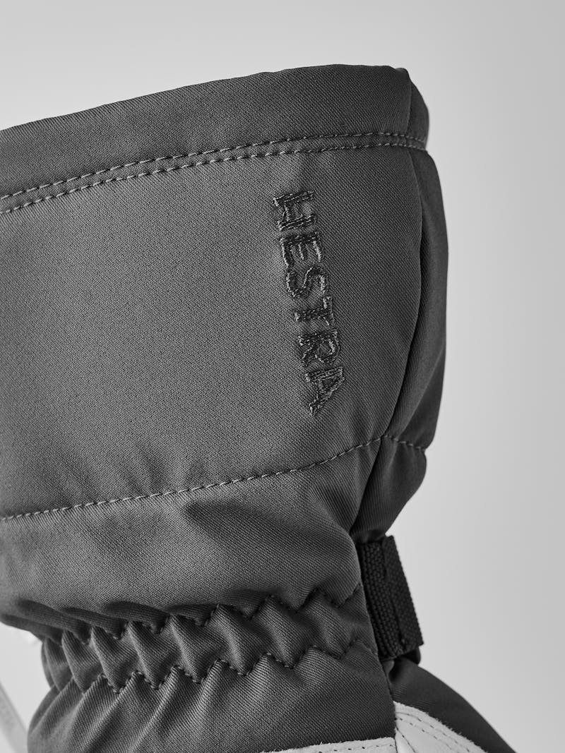 Grauer beheizbarer Fausthandschuh mit weißem Ziegenleder an der Innenhand (6 oder 7)