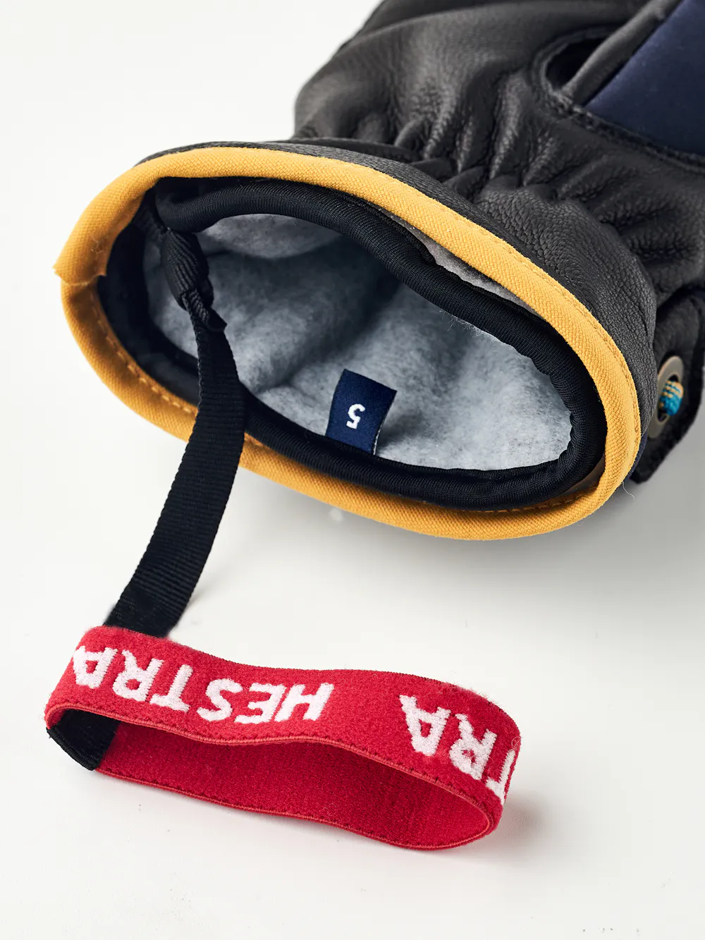 Dark blue children’s glove with black goat leather palm and wrist strap  (5 of 5)