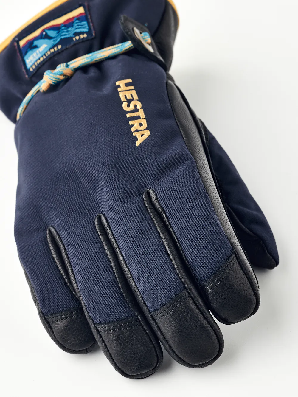 Dark blue children’s glove with black goat leather palm and wrist strap (3 of 5)