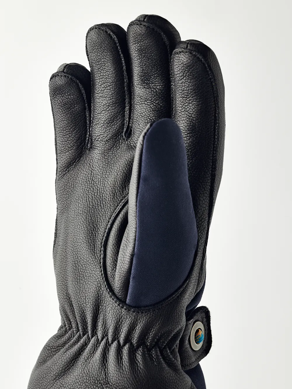 Dark blue children’s glove with black goat leather palm and wrist strap (4 of 5)
