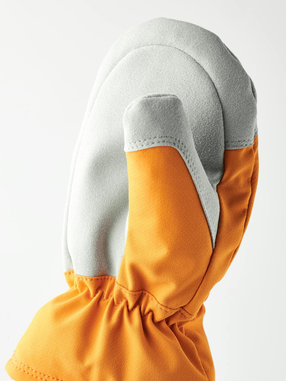 Orange tumhandske i tyg med vit innerhand i syntetisk mocka
(4 av 4)