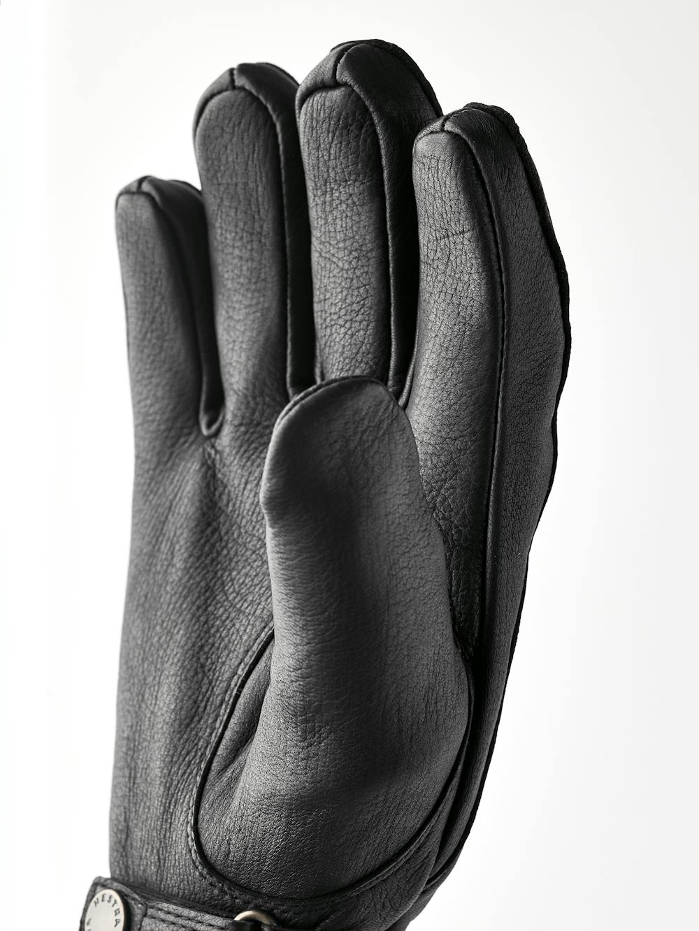Black machine-sewn hairsheep leather glove with leather strap and button
 (3 of 5)