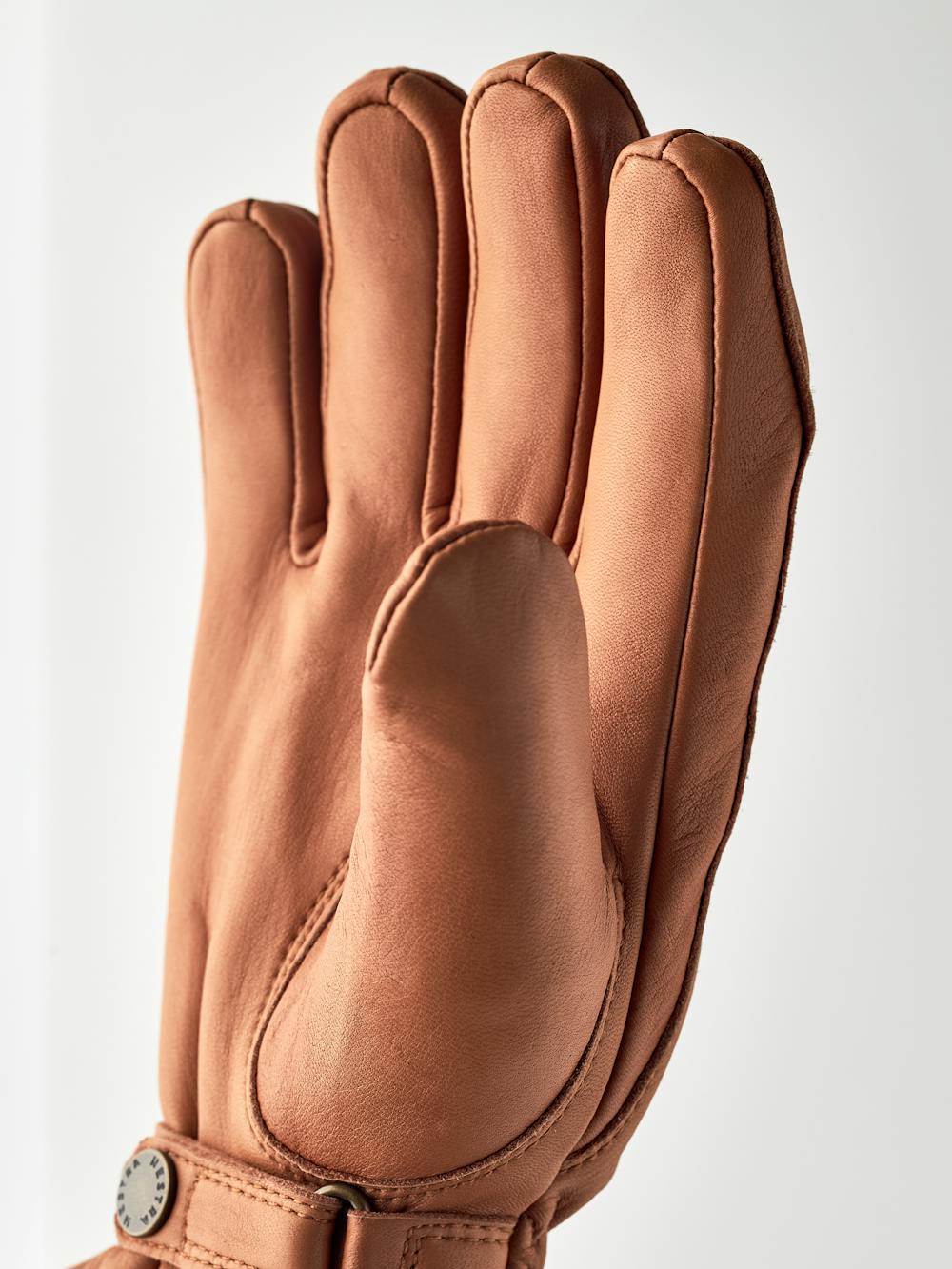 Light brown machine-sewn hairsheep leather glove with leather strap and button
 (3 of 5)