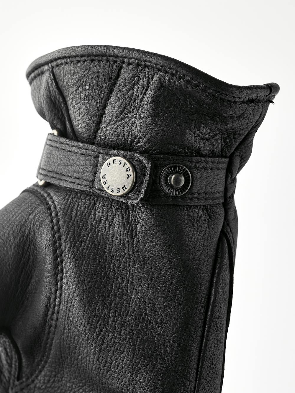 Black machine-sewn hairsheep leather glove with leather strap and button
 (5 of 5)