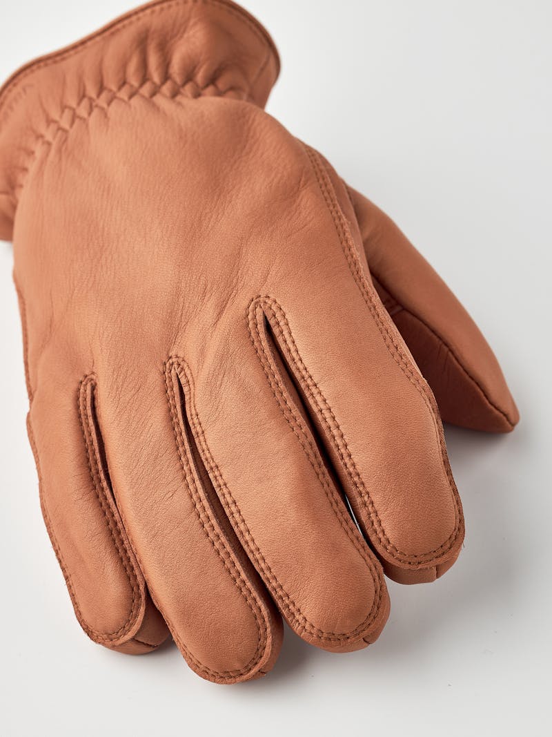 Light brown machine-sewn hairsheep leather glove with leather strap and button
 (3 of 5)