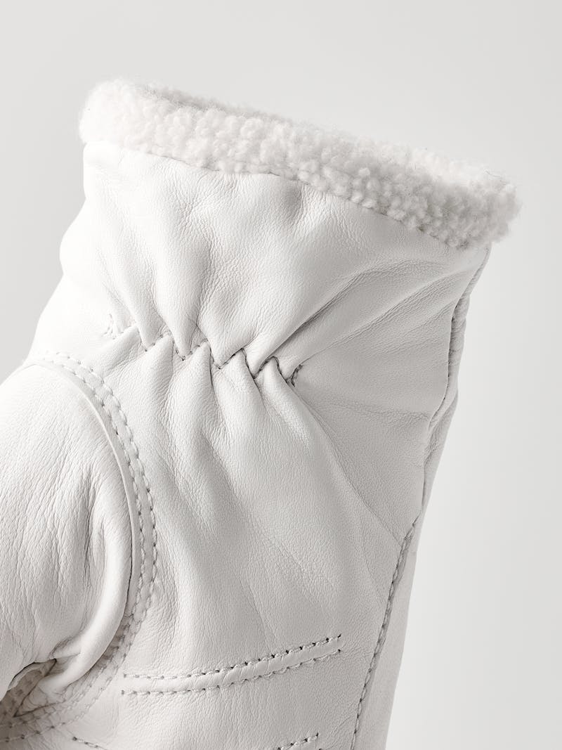 White machine-sewn hairsheep leather glove with visible wool fleece trim
 (4 of 5)