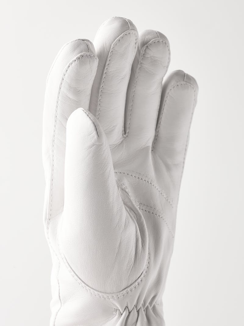 White machine-sewn hairsheep leather glove with visible wool fleece trim
 (3 of 5)