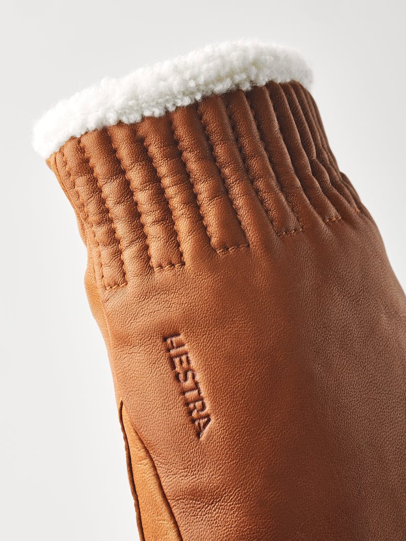 Light brownish-yellow machine-sewn hairsheep leather mitten with white visible wool fleece trim
 (5 of 5)