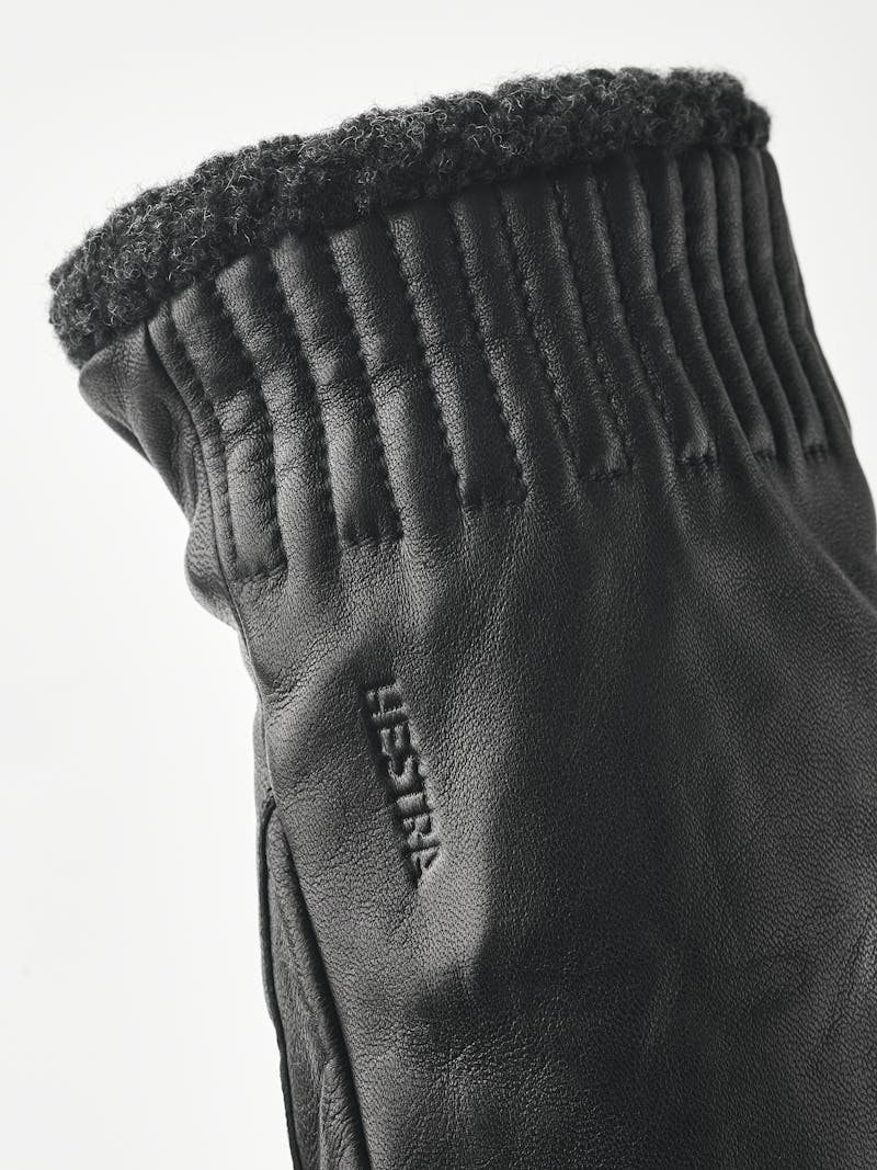 Black machine-sewn hairsheep leather mitten with visible wool fleece trim
 (5 of 5)