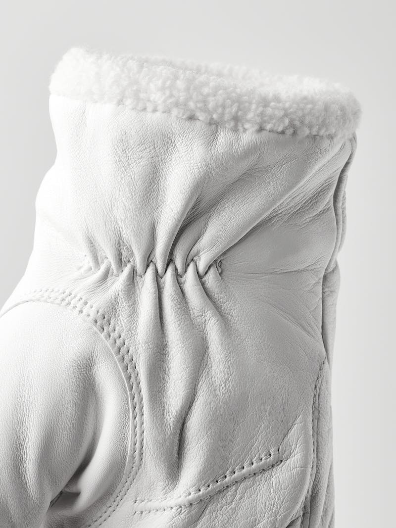 White machine-sewn hairsheep leather mitten with visible wool fleece trim
 (4 of 5)