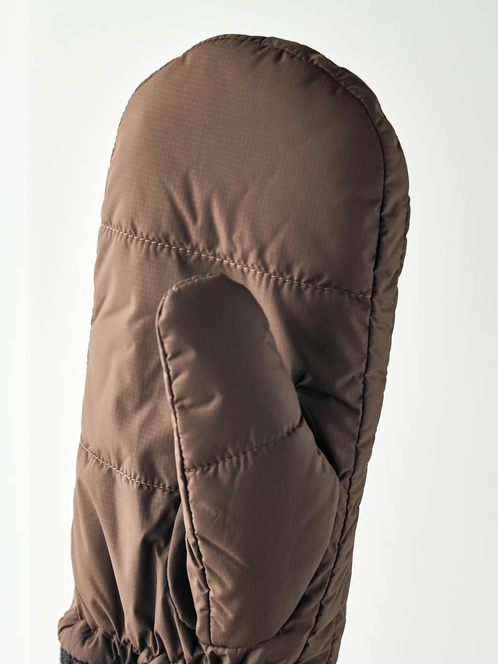 Brown fabric mitten with dark gray knitted cuff
(2 of 3)