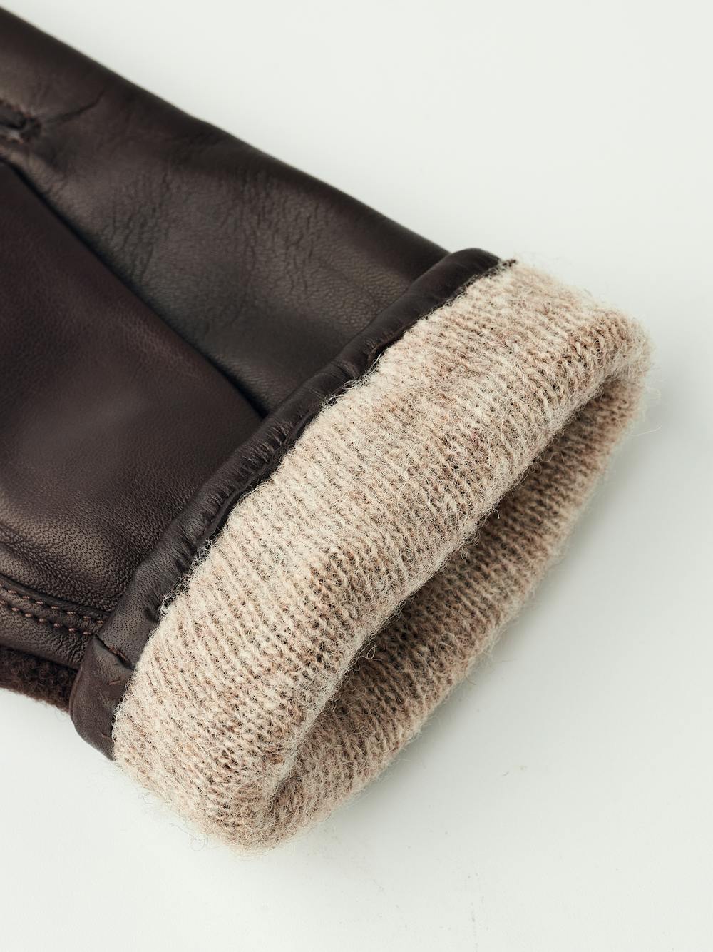 Dark brown hairsheep leather glove with bouclé knitted back and small bow
(5 of 5)
