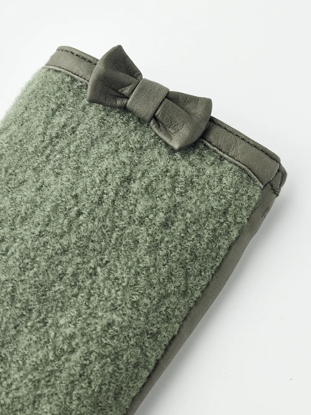 Green hairsheep leather glove with bouclé knitted back and small bow
 (4 of 5)