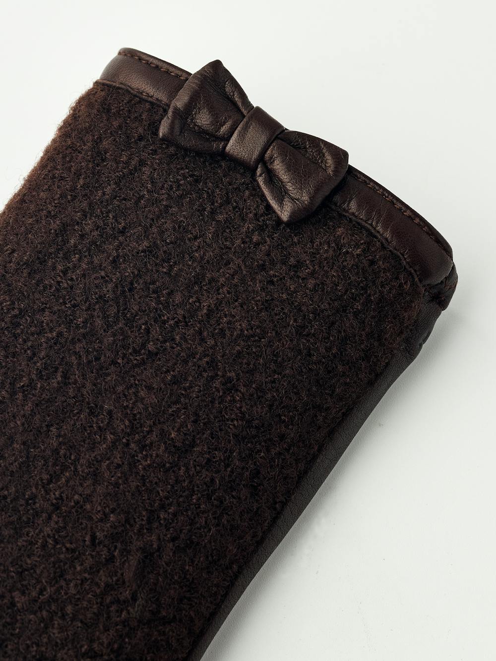 Dark brown hairsheep leather glove with bouclé knitted back and small bow
 (4 of 5)