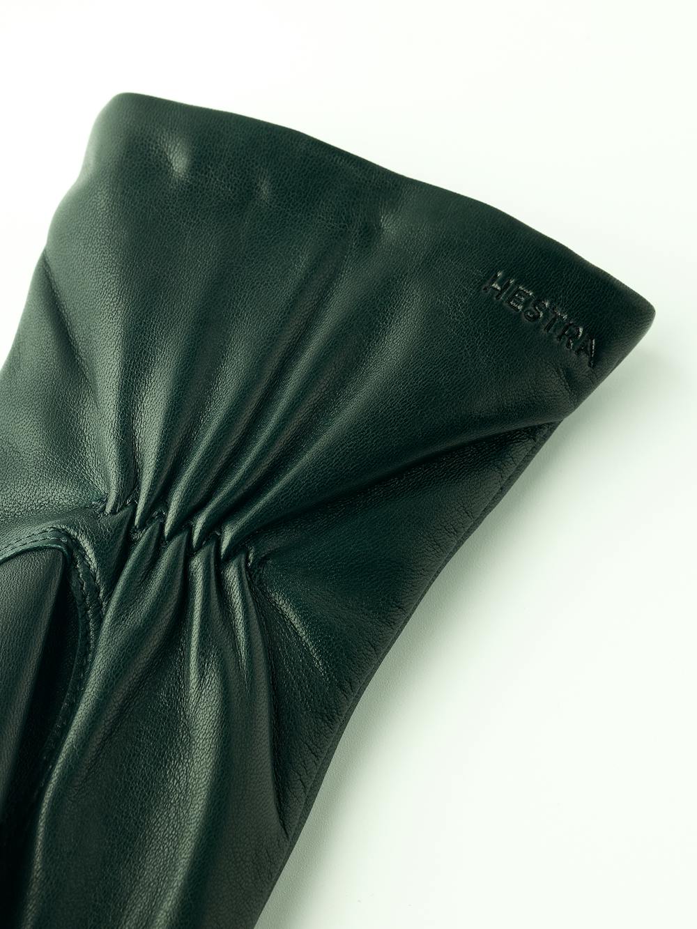 Dark green machine-sewn hairsheep leather glove with zip
(5 of 6)