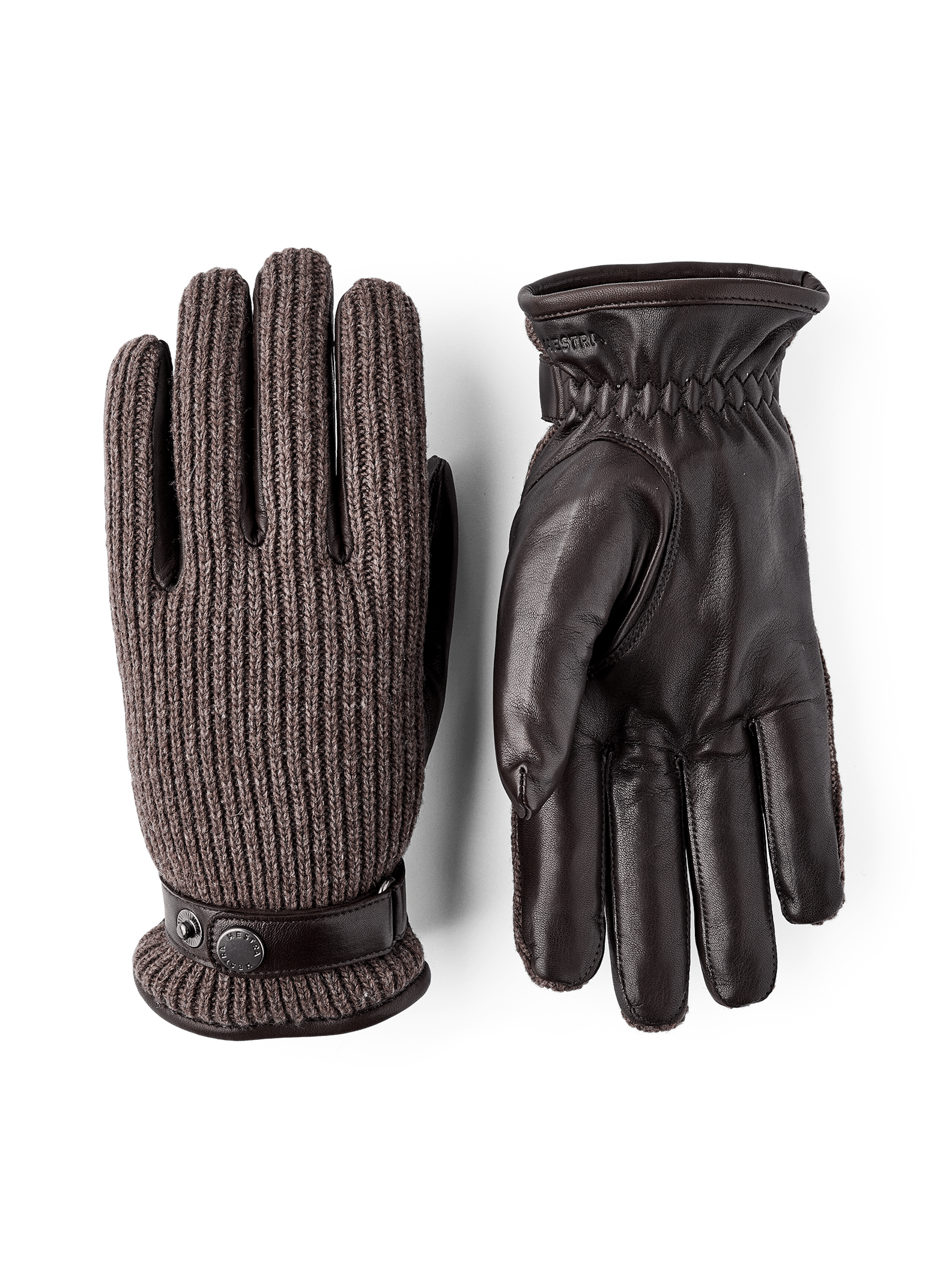 Mörkbrun maskinsydd handske i lammnappa med brun ribbstickad backhand i ull
(1 av 5)